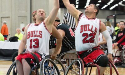 Exciting wheelchair basketball game showcasing talent and teamwork indoors.