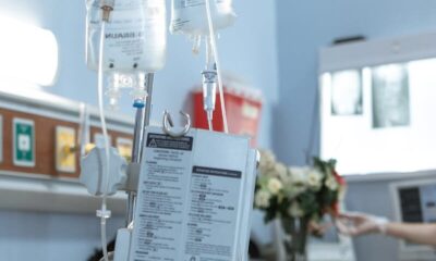 A patient receiving intravenous treatment in a hospital room, emphasizing healthcare and recovery.