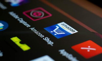 Close-up of the Amazon shopping app icon on a smartphone screen. Ideal for online shopping and technology themes.