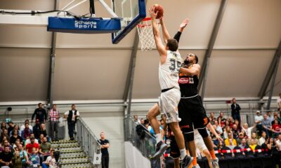 man holding ball dunk in ring