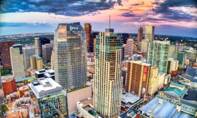 high rise buildings under white clouds and blue sky during daytime