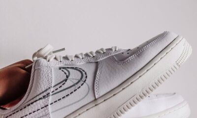 Minimalist close-up of fashionable white sneakers, perfect for modern lifestyle themes.