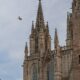 Stunning gothic spires of the Barcelona Cathedral under a blue sky.