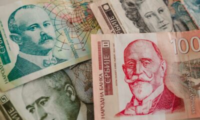 A pile of money sitting on top of a table