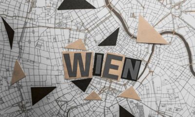 Abstract top view of Vienna map with artistic geometric cutouts, highlighting 'Wien.'
