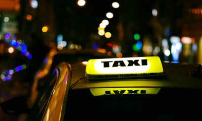 a taxi cab with a taxi light on top of it