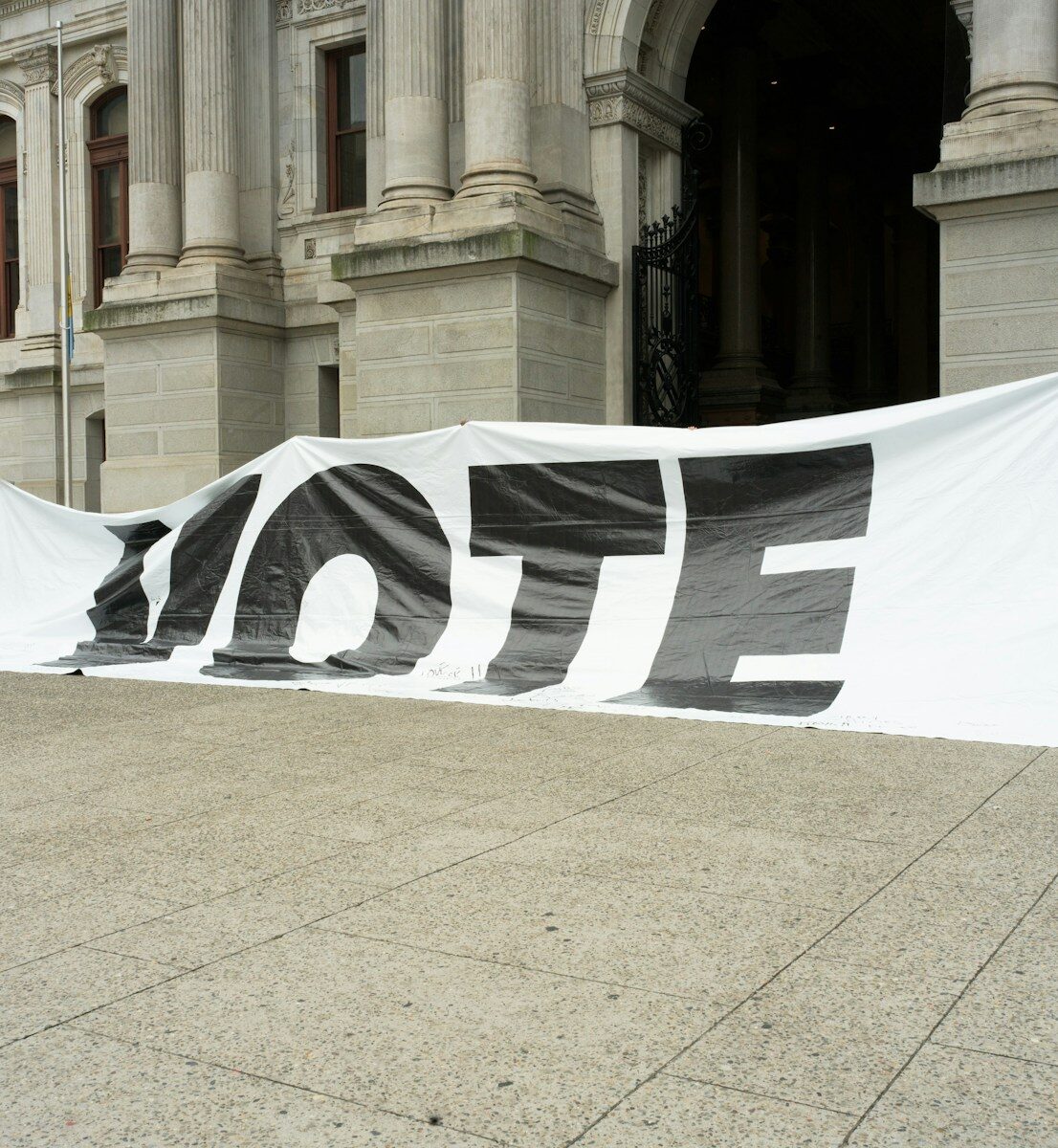 A large sign that says vote on it