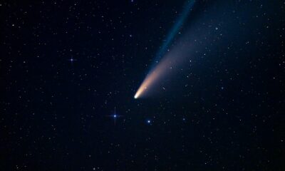 a comet is seen in the night sky