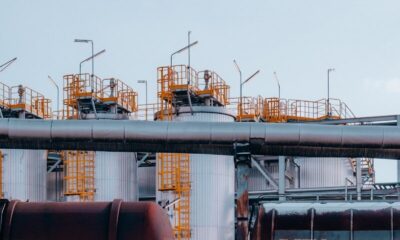 a train on a train track near a building