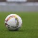white and gray Adidas soccerball on lawn grass