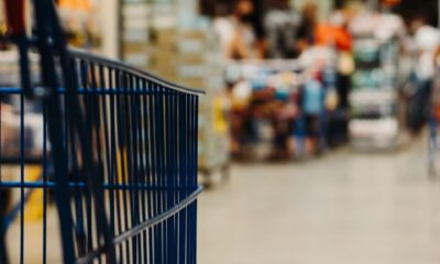 blue shopping cart on street during daytime