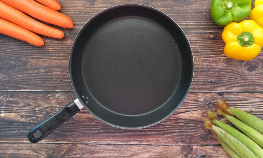 black round plate on brown wooden table
