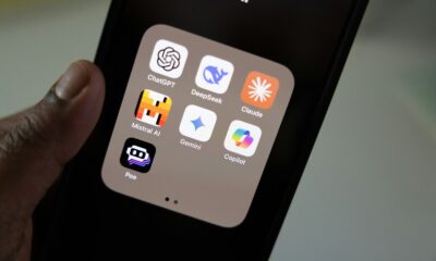 A person holding a smart phone in their hand