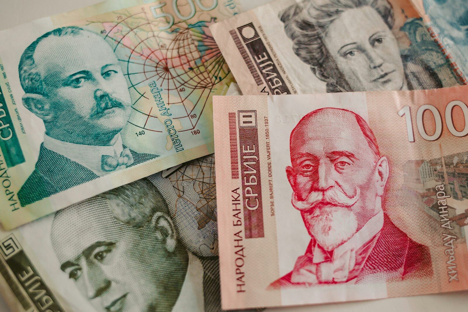 A pile of money sitting on top of a table