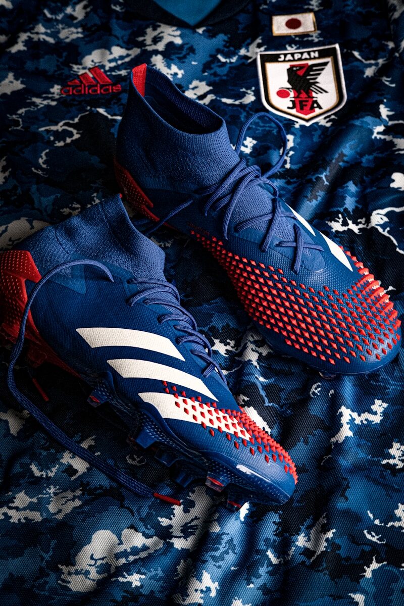 red and black nike athletic shoes