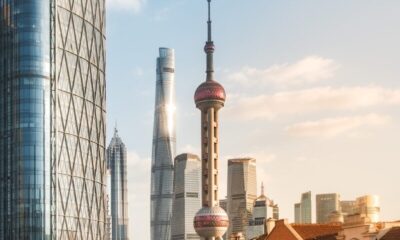 Modern skyscrapers and historic buildings by river