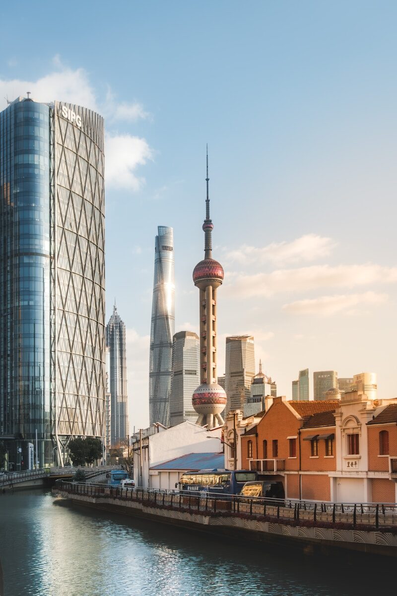 Modern skyscrapers and historic buildings by river