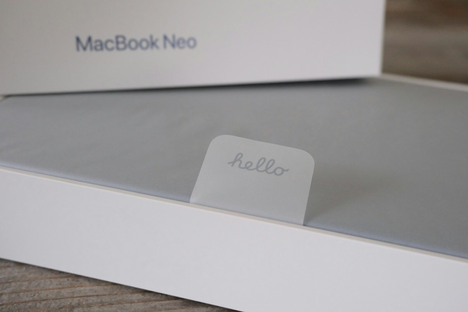 Macbook neo box with a hello sticker
