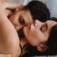 A tender embrace between a loving couple, showcasing intimacy and affection indoors.