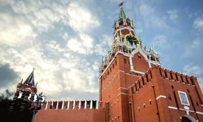 View of the Spasskaya Tower of the Moscow Kremlin against a cloudy sky. Architectural landmark.