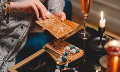 A serene tarot reading setup with elegant lighting and champagne, adding a mystical ambiance.