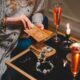 A serene tarot reading setup with elegant lighting and champagne, adding a mystical ambiance.