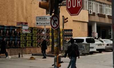 City intersection in Turkey with stop sign, pedestrians, and buildings