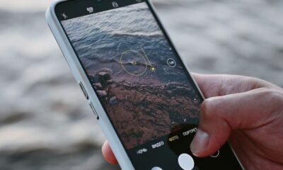 A smartphone capturing ocean waves, highlighting modern mobile photography.
