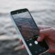 A smartphone capturing ocean waves, highlighting modern mobile photography.