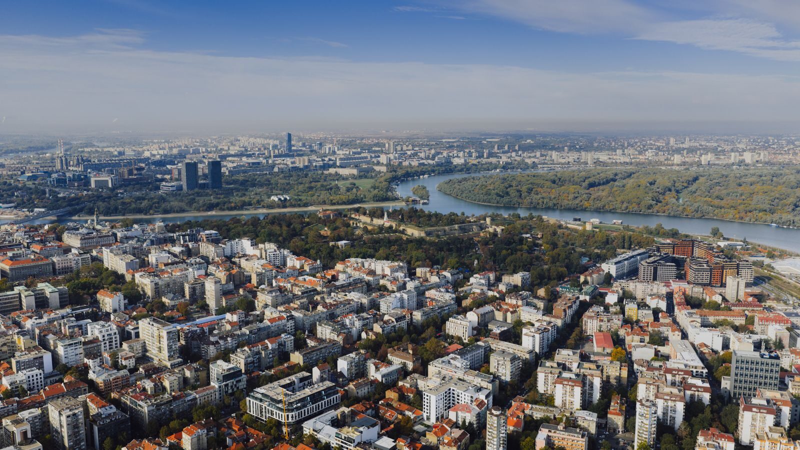 Stunning aerial view of Belgrade cityscape with the Danube river and city skyline in Serbia.