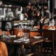 From above of classic style cafe interior with wooden chairs and shiny glasses near cutlery on cloth napkins on table in daylight