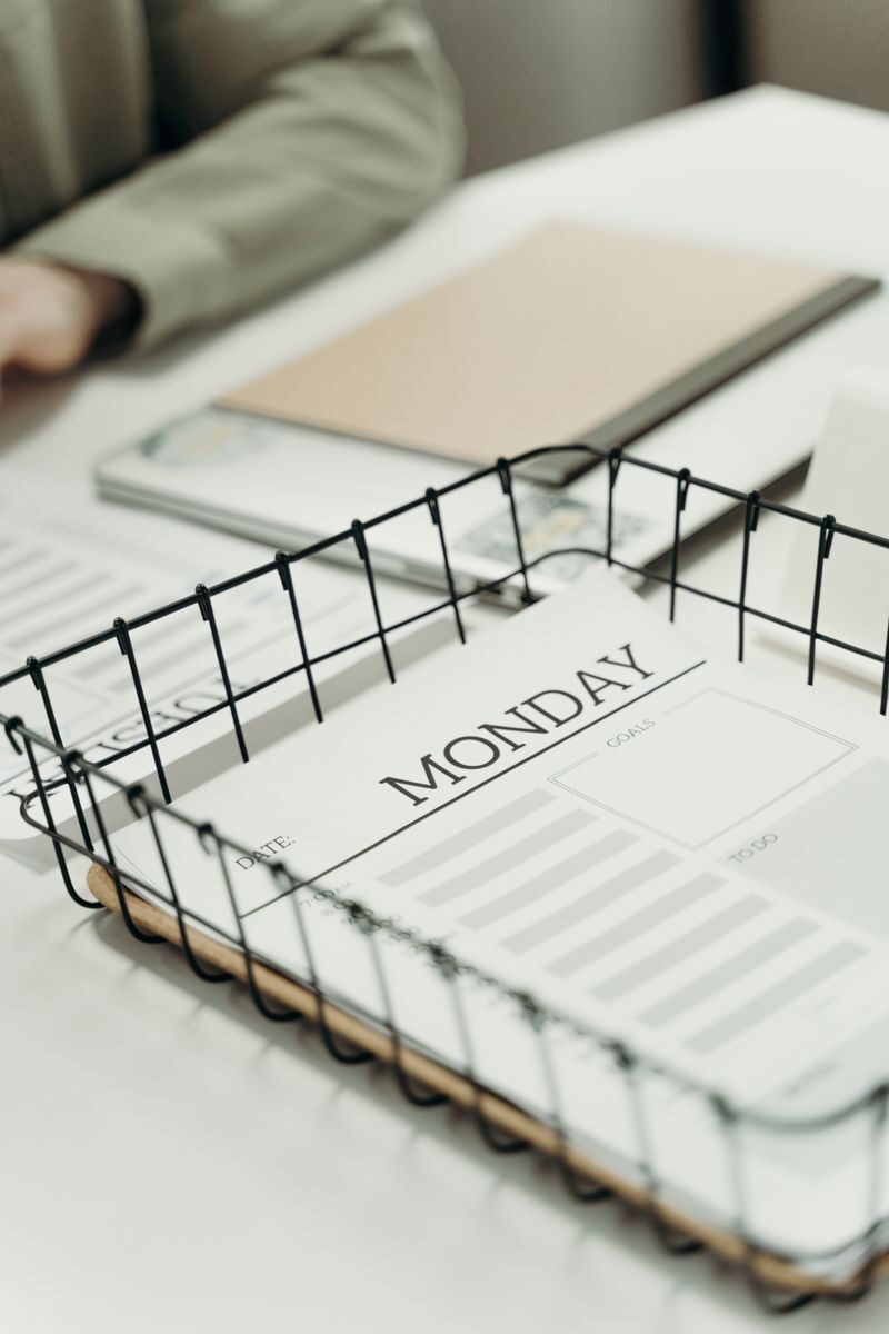 Top view of a Monday planner in an office setting, ideal for organizing schedules.