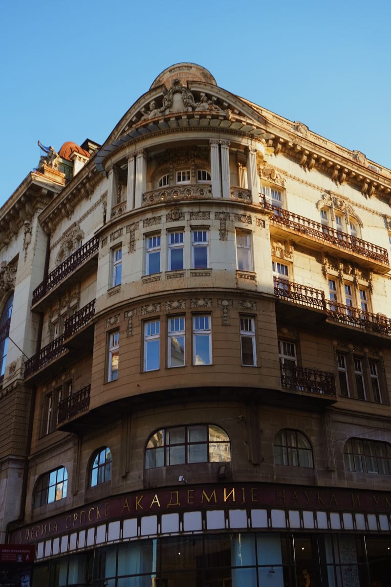 A stunning Neo-Renaissance building in Belgrade showcasing intricate architectural details under clear skies.