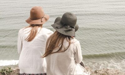 beach, hats, women, pair, couple, fashion, style, stylish, backs, young women, shore, seashore, friendship, girl friends, ocean, nature, outdoors, people, sand, sea, water, friends