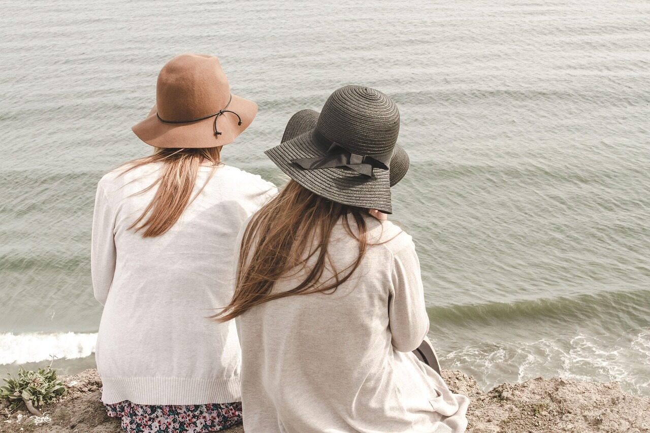 beach, hats, women, pair, couple, fashion, style, stylish, backs, young women, shore, seashore, friendship, girl friends, ocean, nature, outdoors, people, sand, sea, water, friends