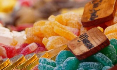Close-up of assorted colorful candies on display. Bright, sugary treats for sale.