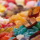 Close-up of assorted colorful candies on display. Bright, sugary treats for sale.