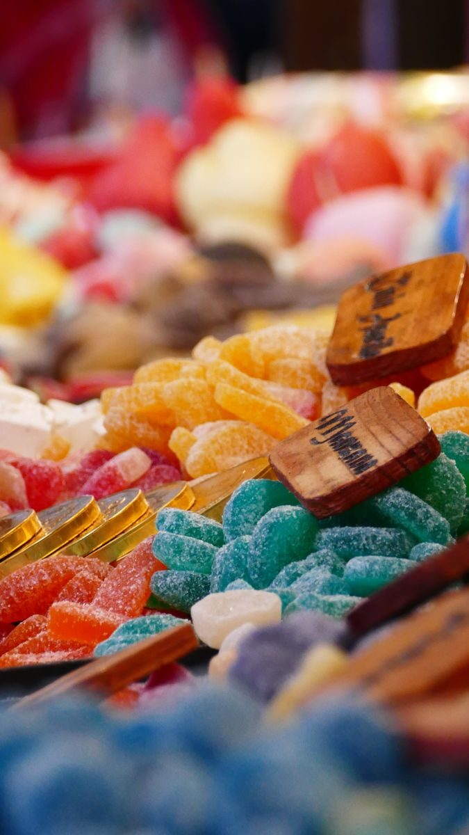 Close-up of assorted colorful candies on display. Bright, sugary treats for sale.