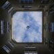A unique view of an airplane flying above a courtyard in Vienna, Austria.