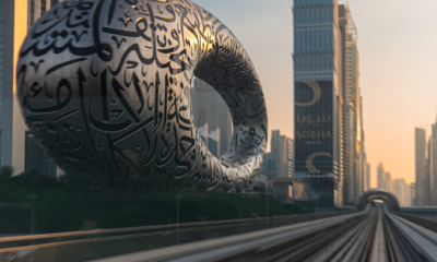 The Museum of the Future and Dubai's skyline captured beautifully at sunset in an urban setting.