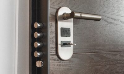 Metal door handle and lock system with key inserted, showcasing security features.