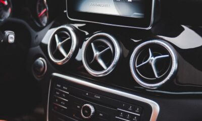 Small black touchpad and loud speakers of modern multimedia player in cabin of automobile