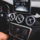 Small black touchpad and loud speakers of modern multimedia player in cabin of automobile