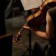 A close-up of a violinist playing during a concert, showcasing musical elegance.
