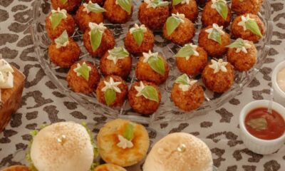 A high-angle view of an elegant spread of assorted gourmet snacks on a decorated table.