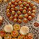 A high-angle view of an elegant spread of assorted gourmet snacks on a decorated table.