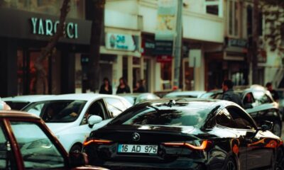 A bustling city street with modern vehicles highlighting urban life and traffic dynamics.