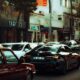 A bustling city street with modern vehicles highlighting urban life and traffic dynamics.