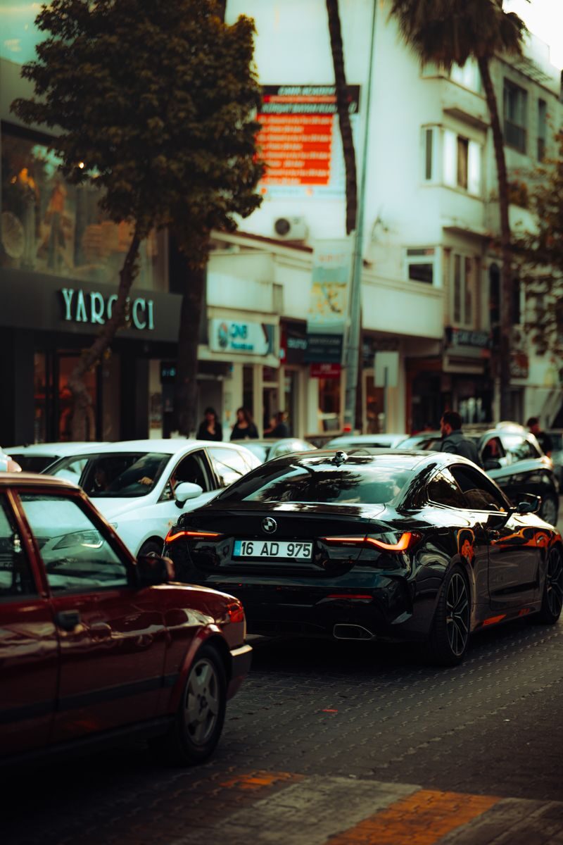 A bustling city street with modern vehicles highlighting urban life and traffic dynamics.