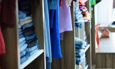Vibrant and neatly arranged clothing in a Brazilian fashion store, showcasing diverse styles.